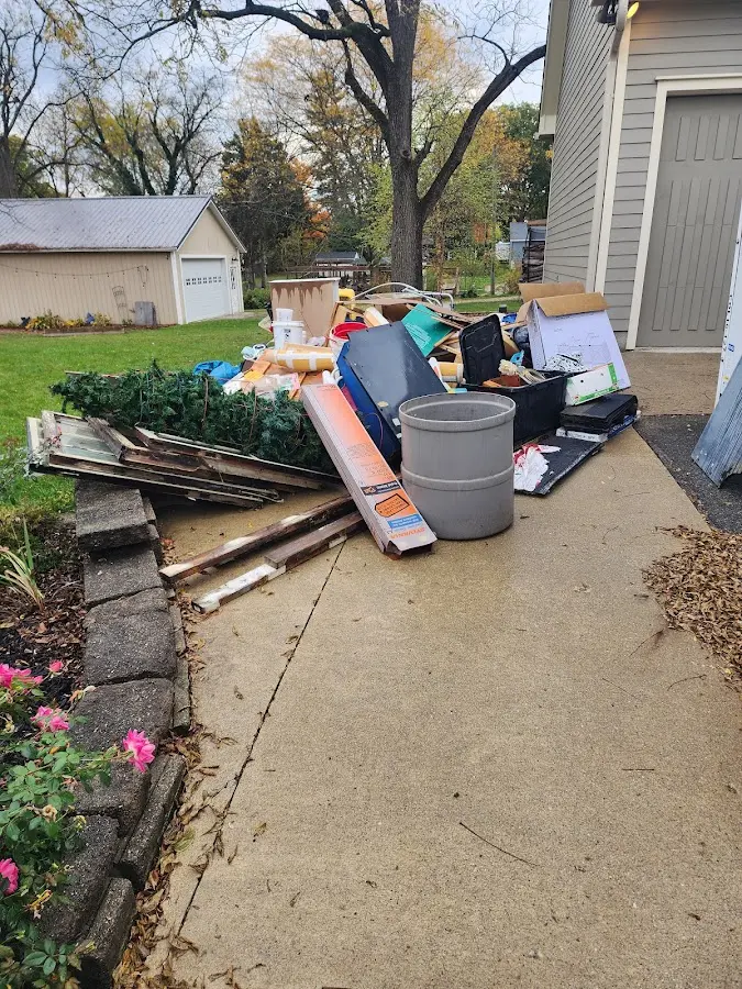 Dumpster being loaded with debris for 12 Yard Dumpster Rental in Pocahontas